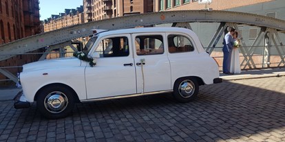 Hochzeitsauto-Vermietung - Einzugsgebiet: international - Hamburg - London Taxi in schneeweiss