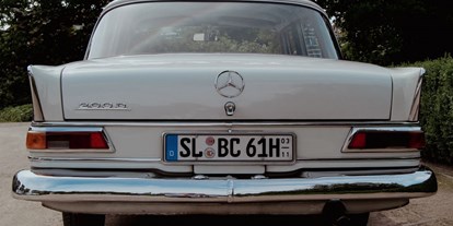 Hochzeitsauto-Vermietung - Farbe: Weiß - Deutschland - Mercedes 200D Heckflosse